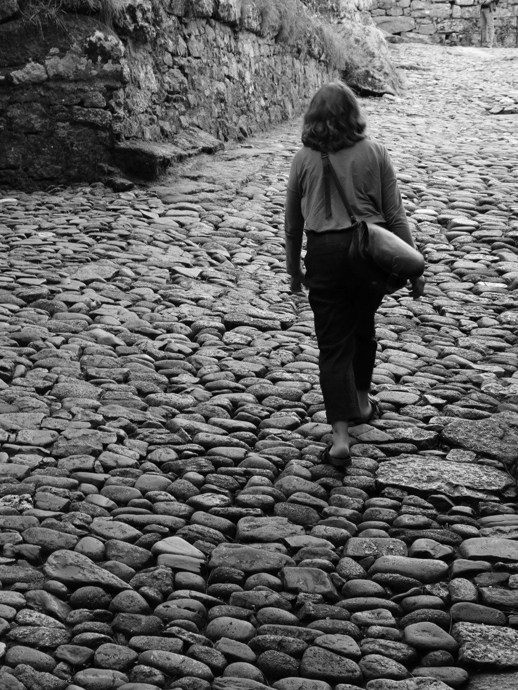 St. Michael’s Mount, Mount’s Bay black and white walking on cobbled path